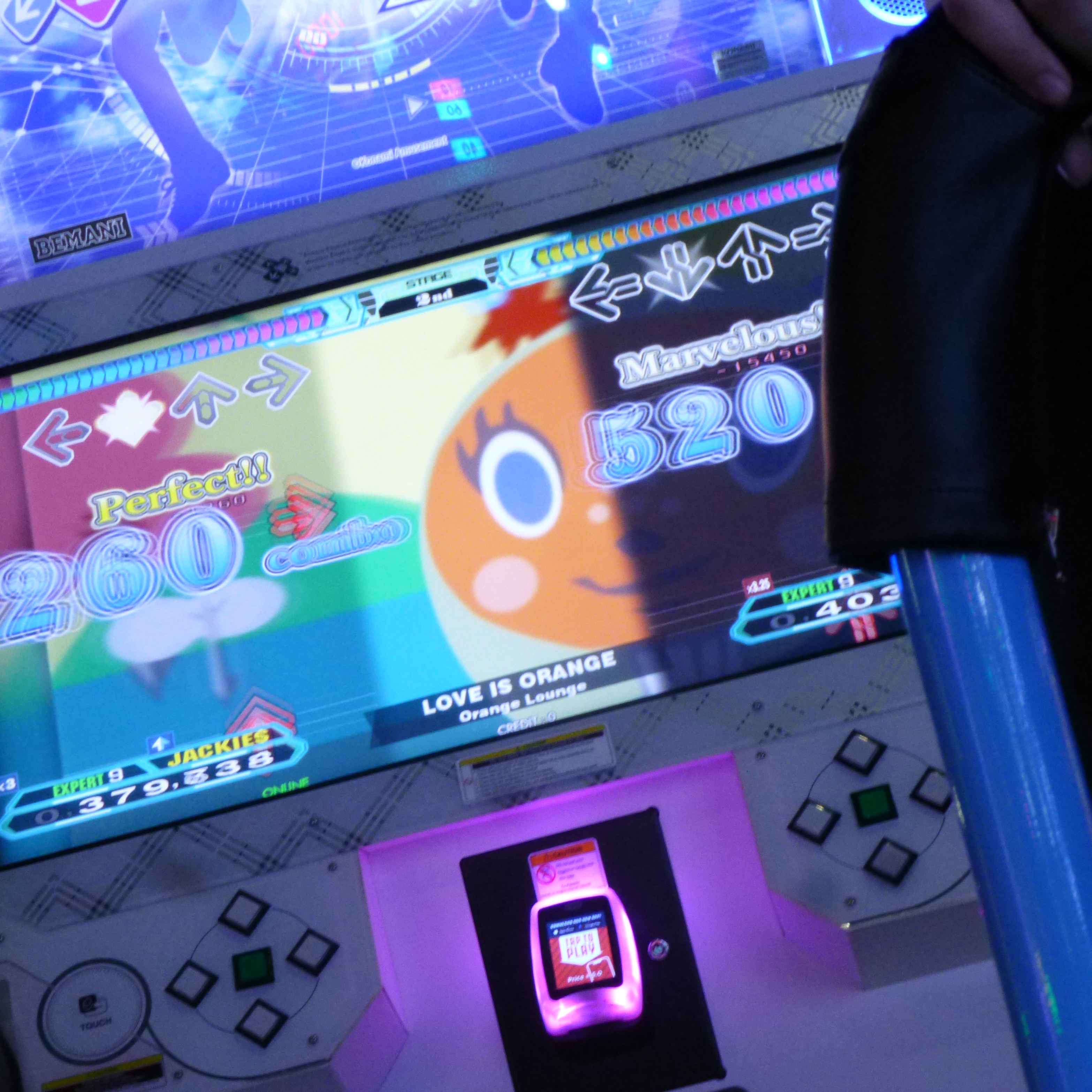 photo of DDR gameplay, song by Orange Lounge